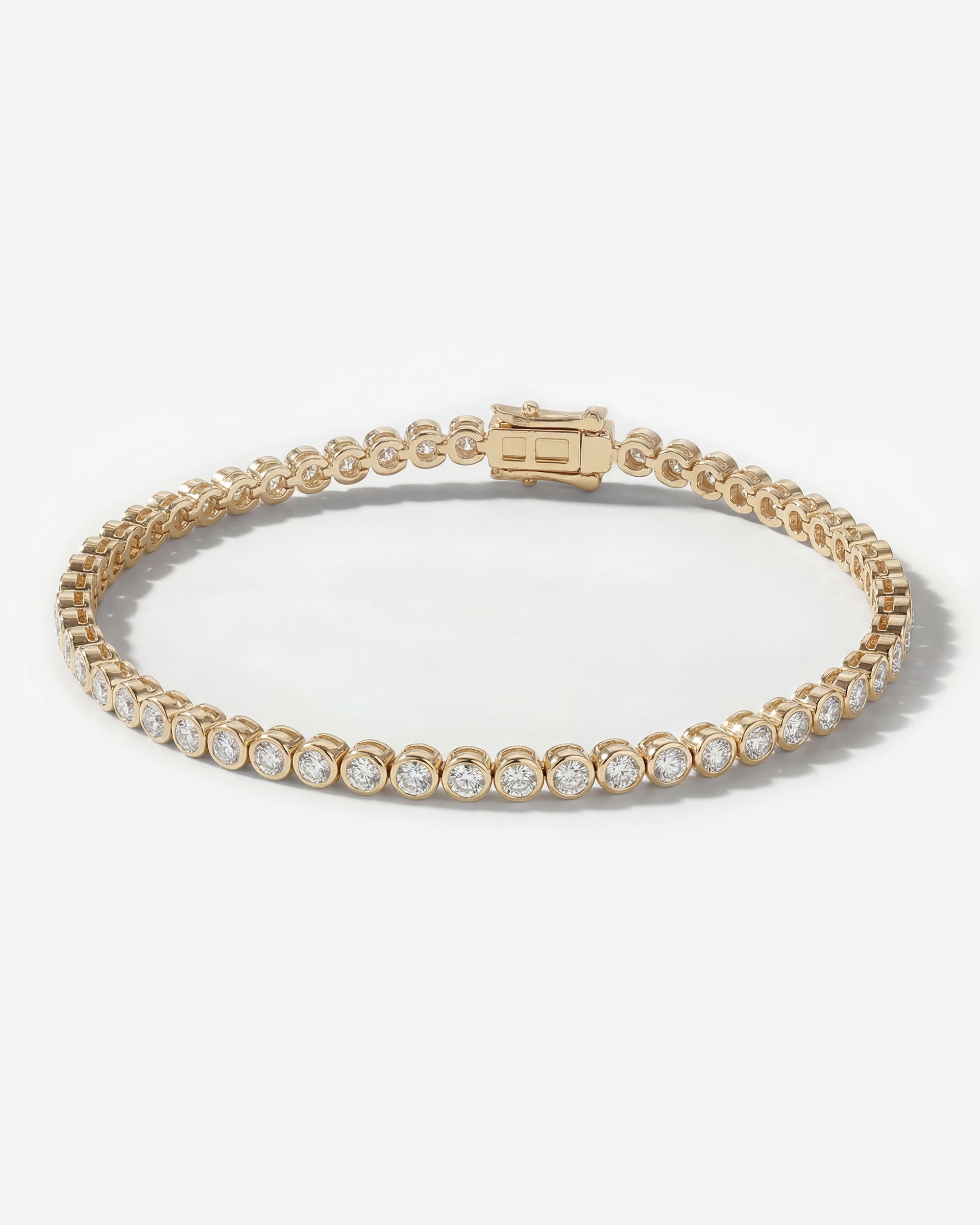 DIAMOND TENNIS BRACELET (BEZEL SET IN YELLOW GOLD)