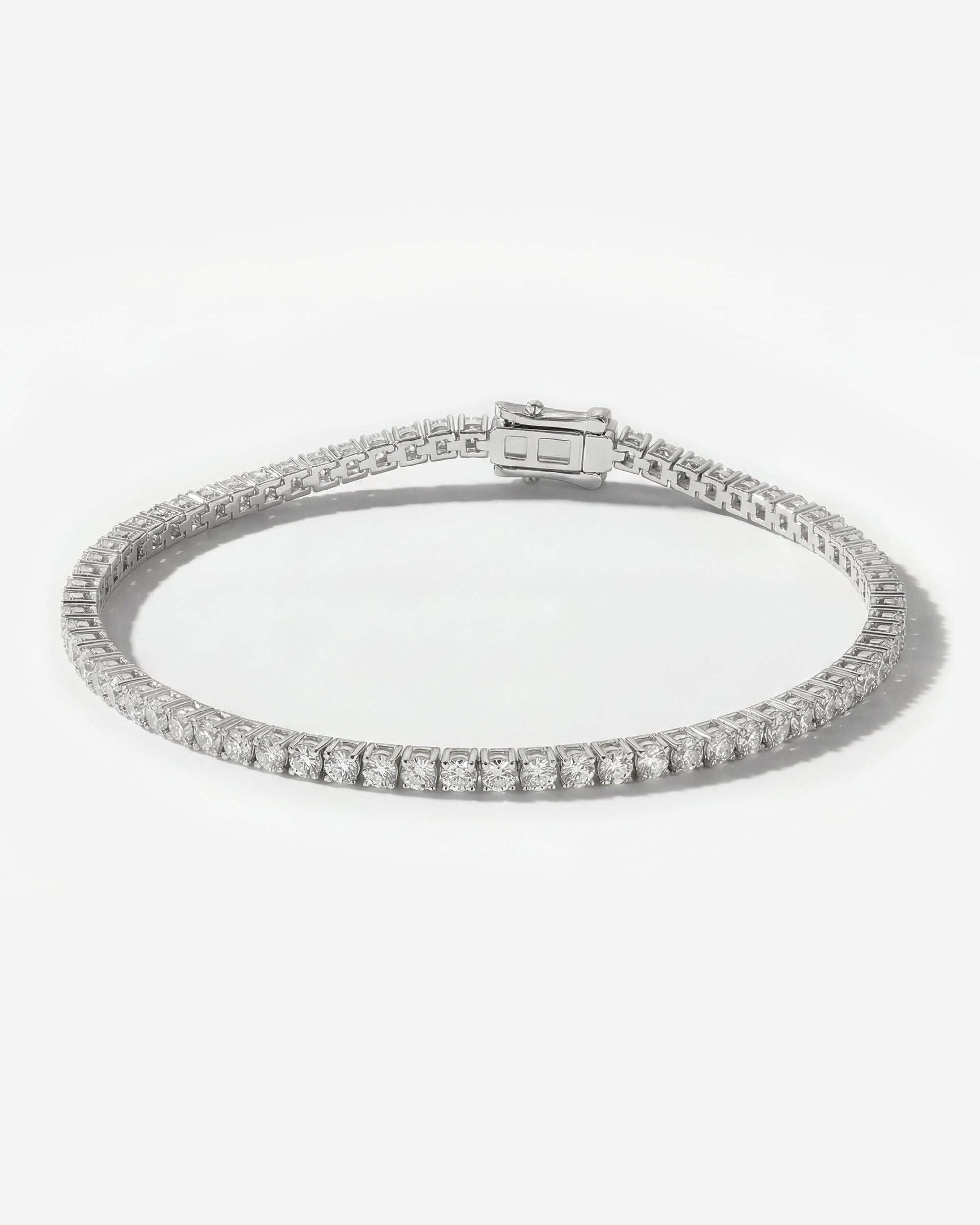 DIAMOND TENNIS BRACELET (BASKET SET IN WHITE GOLD)