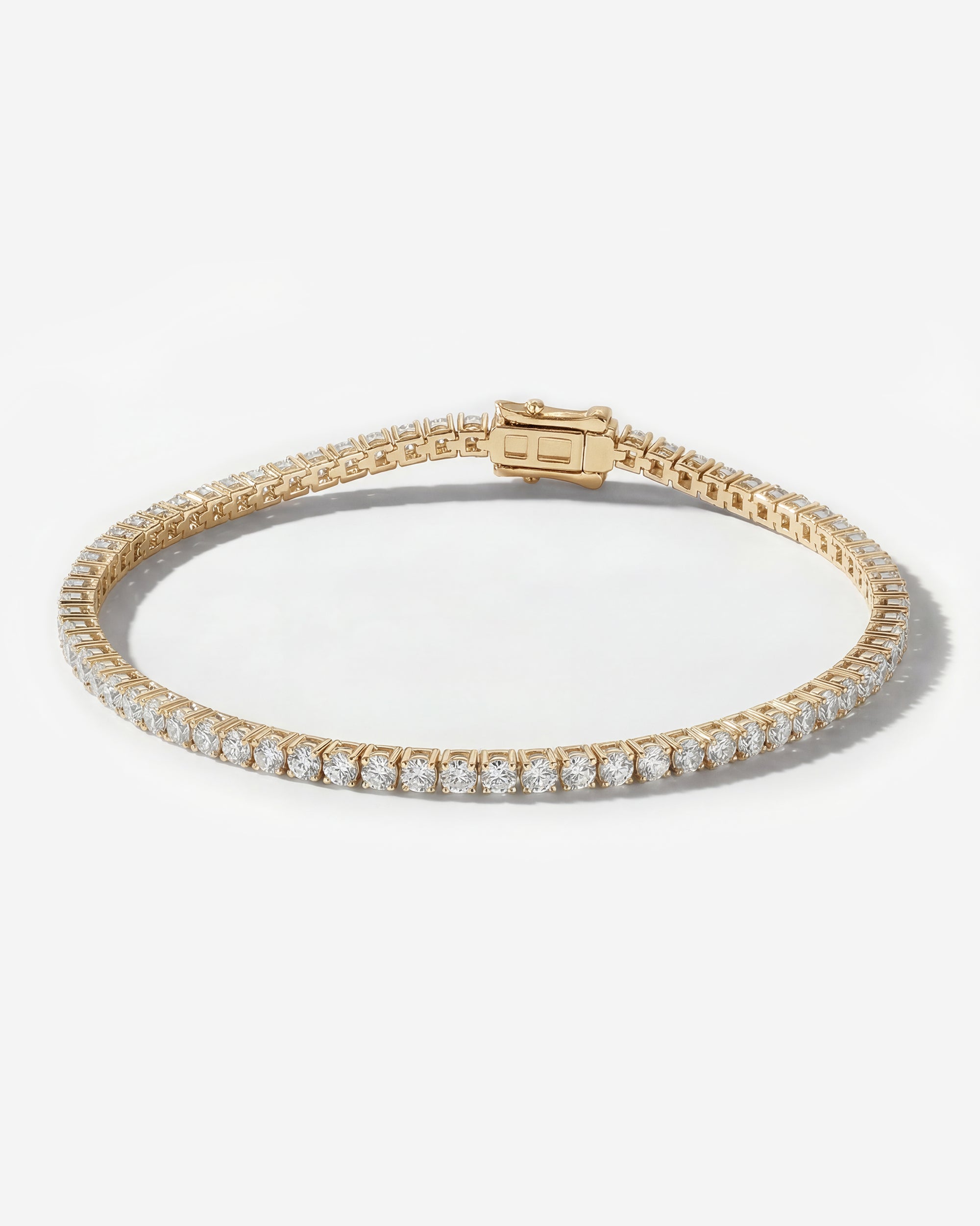 DIAMOND TENNIS BRACELET (BASKET SET IN YELLOW GOLD)